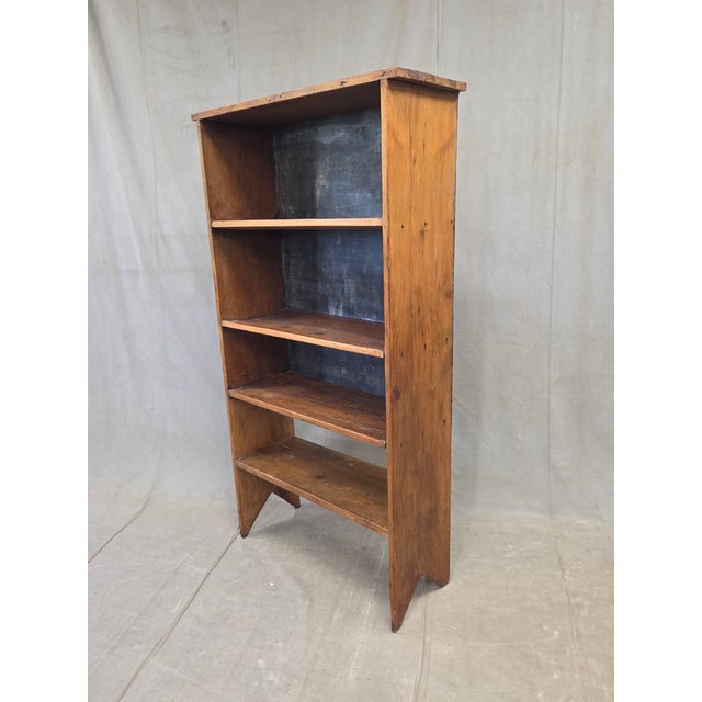A charming and functional vintage (perhaps 1930s or older) rustic primitive handmade peg construction pine bookshelf. Look...