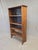 A charming and functional vintage (perhaps 1930s or older) rustic primitive handmade peg construction pine bookshelf. Look...