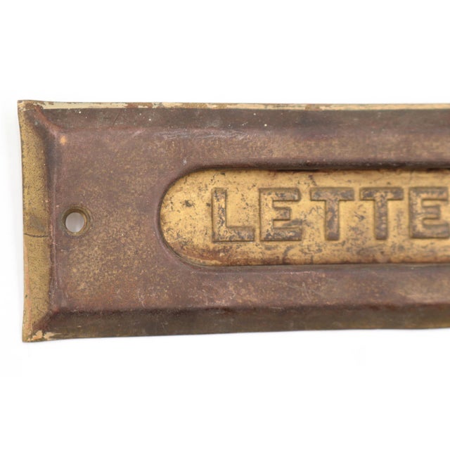 Vintage brass spring loaded mail slot that opens inward at 45 degrees to allow mail through. This is the cover plate only....