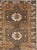 This Mid-20th century Turkish Anatolian room-size carpet presents a disciplined, vertically organized composition in warm...