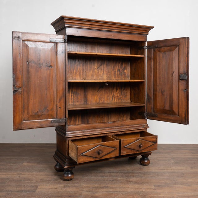 19th-century Swedish two-door armoire crafted in pine with a deeply aged patina and original hinges that function well....