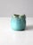This vintage studio pottery pitcher is hand-crafted from ceramic and features a beautiful turquoise blue glaze. The base...