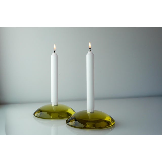 A pair of iconic “Stop” glass candlesticks designed by Anne Nilsson for Kosta Boda, Sweden. These sculptural candleholders...
