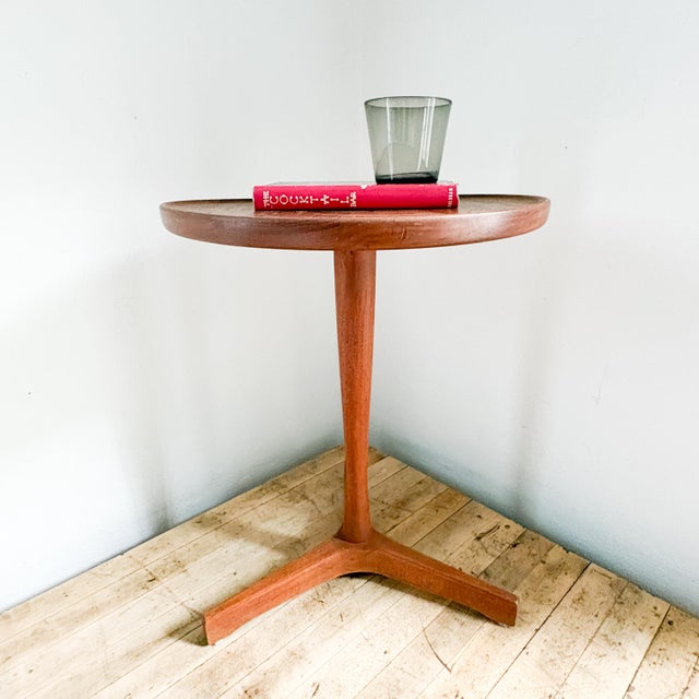 This beautiful and timeless 1960's piece, stamped and marked on underside of tabletop "Made in Denmark Designed by Hans C....