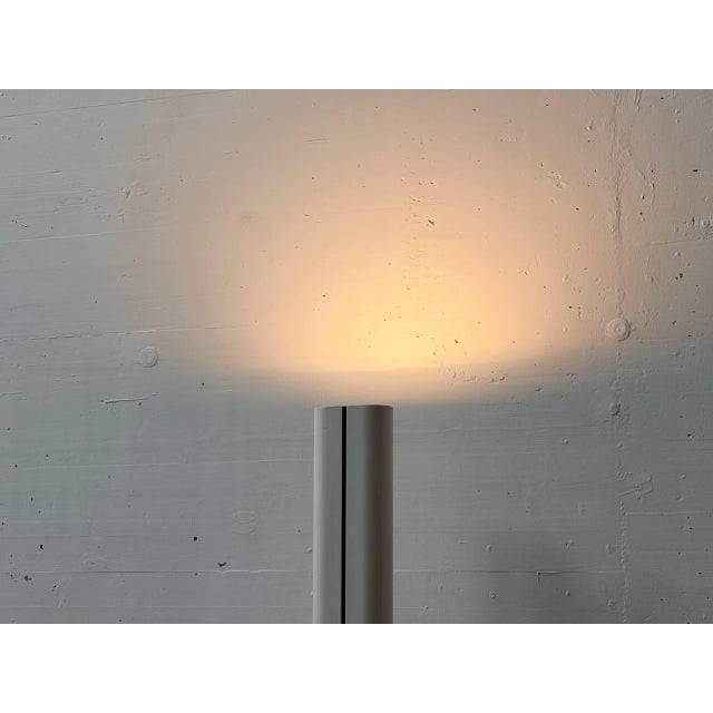 The iconic megaron floor lamp, designed by italian designer gianfranco frattini for artemide in the 1970s, is...