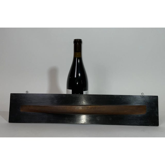 Naval architect's builder half model of a double ended launch or speedboat. Built of several laminated lifts. Mounted to a...