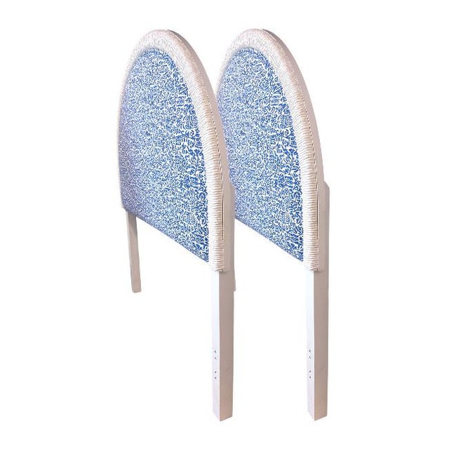 A stylish pair of arch-top headboards newly upholstered in a striking blue-and-white Schumacher fabric. These statement...