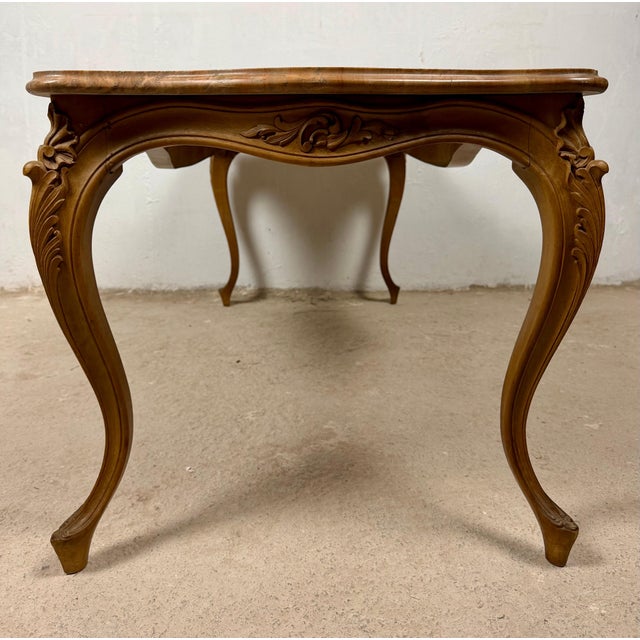 Elegant French Louis XV style coffee table crafted in solid wood, featuring a shaped marble top, graceful cabriole legs,...