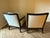 Kreiss side chairs. Set of 2 upholstered siding with sleek wood finish. Back pillows included.