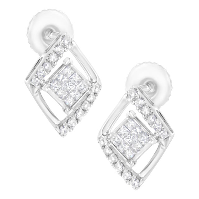 Elegant and timeless, these gorgeous 10 karat white gold stud earrings feature 0.327 carat total weight of diamonds with...