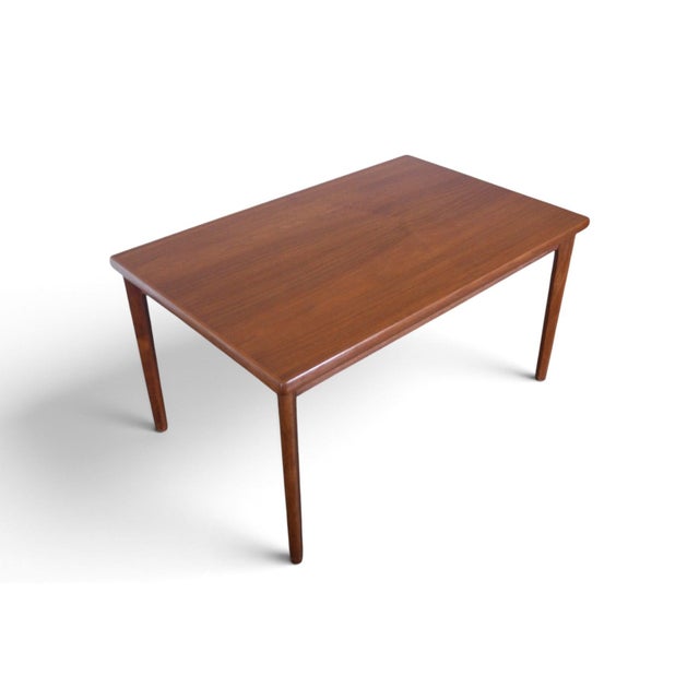 This dining table was designed by Henning Kjaernulf and produced by Vejle Støle in Denmark during the 1960s. The teak...