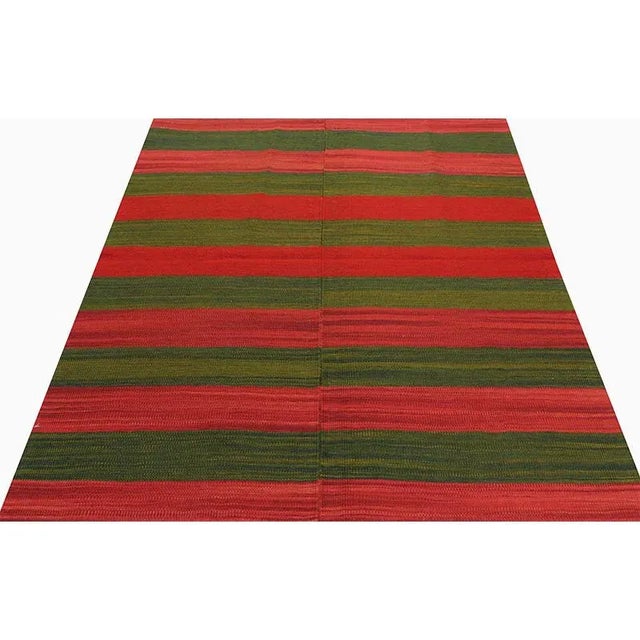 This remarkable contemporary Scandinavian Style Kilim area rug features a dramatic pop of electrifying colors in a...
