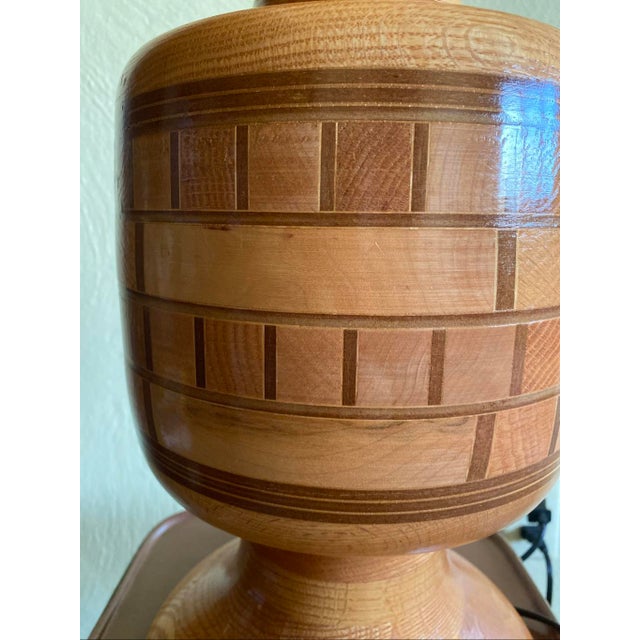 19” to the top of the socket 8” diameter Good condition This lamp is a masterclass in segmented woodturning. It features a...