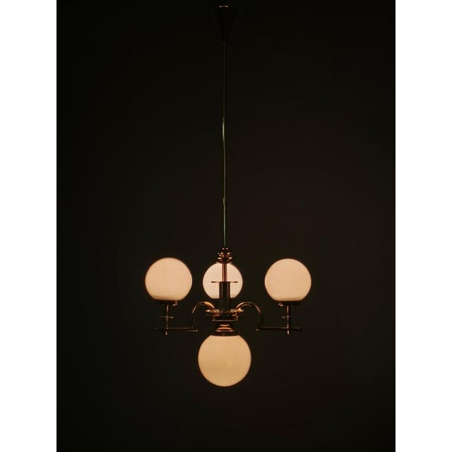 Exceptional original art deco chandelier produced in czechoslovakia during the 1930s, featuring an architectural brass and...