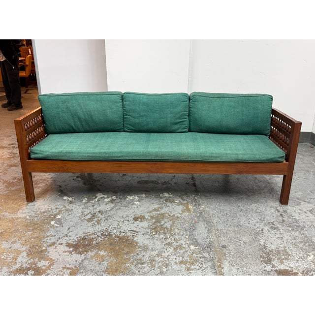 Design Plus Gallery presents a Settee/Day Bed of Moroccan Design. The wooden bed/settee has a frame with mousharabi...