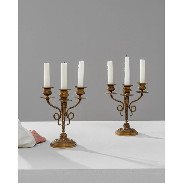 This exquisite pair of 19th Century French Brass Candle Holders is a testament to the opulent design and craftsmanship of...