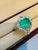 7 Ct Finest Zambian Emerald Cut Emerald & 1.5Ct Diamond Ring, 18 Kt Gold Size 9 This classic ring features an Emerald cut...