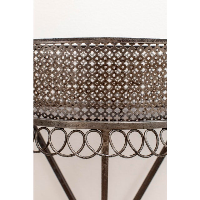 Intricately detailed metal plant stand from Mathieu Mategot's Cap D'ail series using his patented perforated sheet metal...