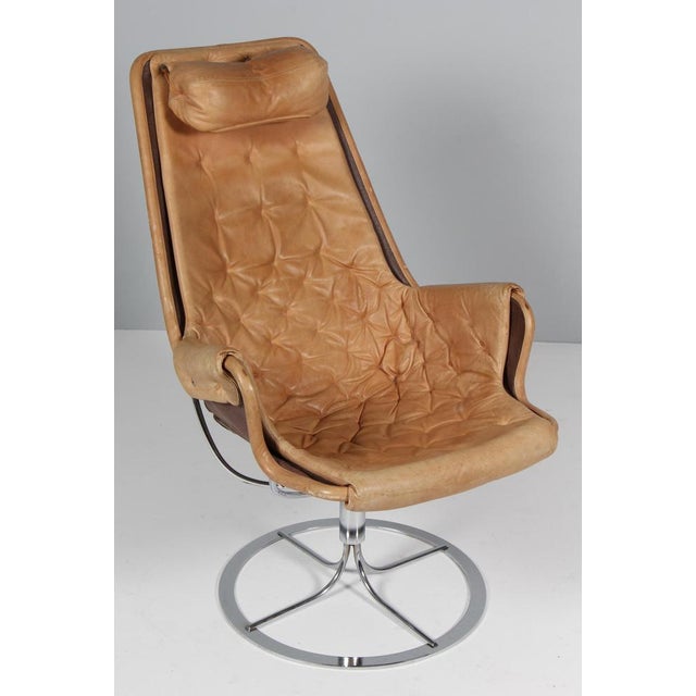 Bruno Mathsson Jetson loung chair with patinated tan leather. Frame in chromed steel. Made by DUX. This piece is...