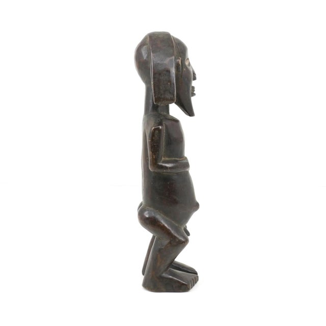 This miniature Songye power figure has hands on a prominent belly. The Songye people are an ethnic group located in the...