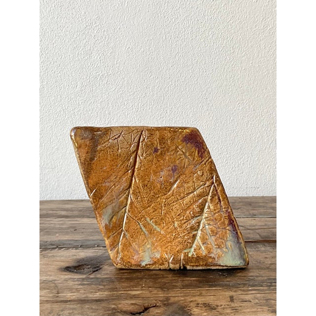 This striking vintage studio pottery sculpture by Kaplan is a masterclass in Brutalist-inspired organic modernism. Hand-...