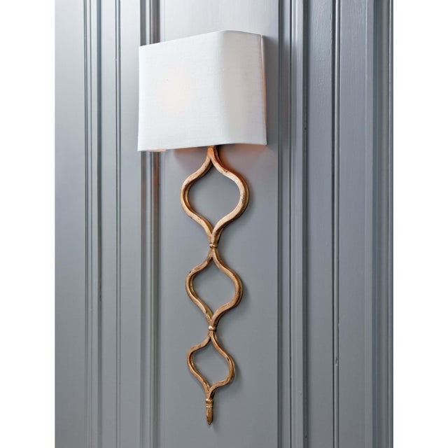 With a rich gold lead finish, the elegant twisting pattern of the Sinuous metal sconce creates a stylish statement. Topped...