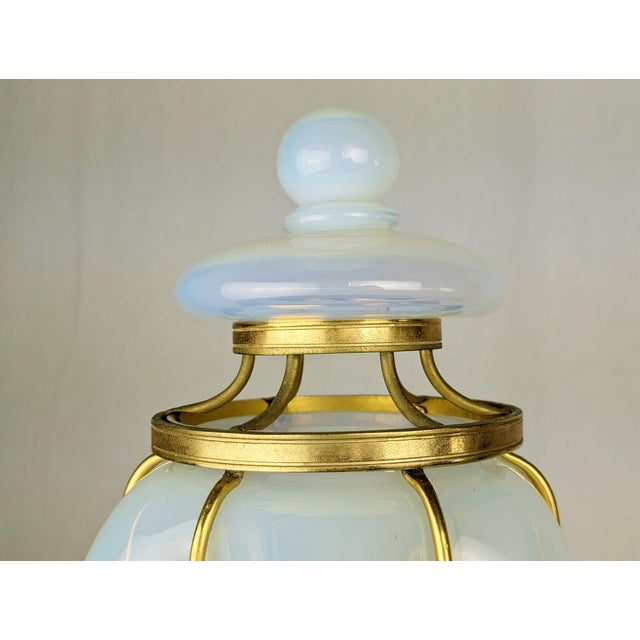 Rare and important iridescent Murano glass & gilted metal sconce manufactured in Murano around the 1940s. This large...