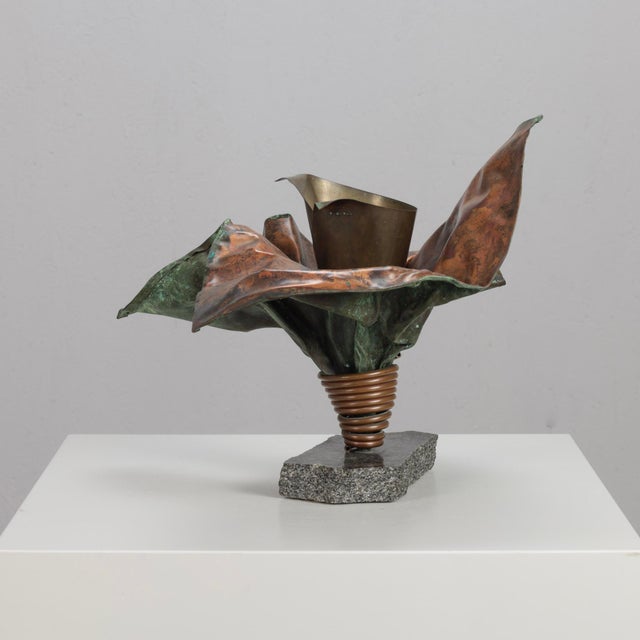 A striking sculptural vase by dutch artist bart van bekhoven, handcrafted from folded and hammered copper. The dynamic...
