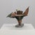 A striking sculptural vase by dutch artist bart van bekhoven, handcrafted from folded and hammered copper. The dynamic...