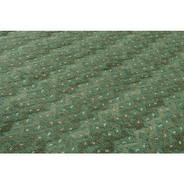 Hand-knotted in wool, this 13x11 rug in green is an exciting new addition to the Scandinavian rug collection by Rug &...