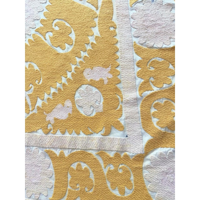 Vintage Suzani from Central Asian, circa late 1960s. There are stains on this suzani. Dimension; 56'' x 61'' inches / 141...