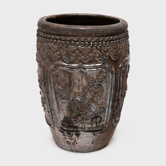 This large ceramic jar was hand-crafted in China's Shanxi province over a century ago. Dated to the late 19th century, the...
