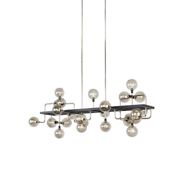 The Viaggio Linear Suspension by Sean Lavin for Tech Lighting features an artistic cluster of glass orbs for a sense of...