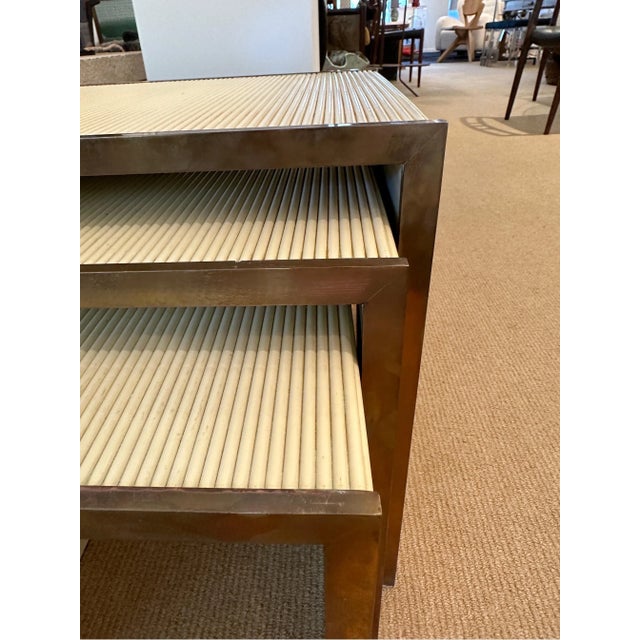 Set of three Nesting Coffee Tables in wood and brass details made by Tommaso Barbi. Decorated with a "grissinato" effect...