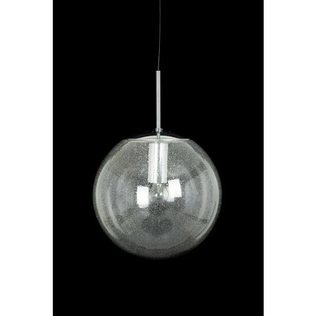 1 of 2 large smoked glass ball pendants, manufactured by limburg, germany, circa 1970-1979. Sockets: one x e27 standard...