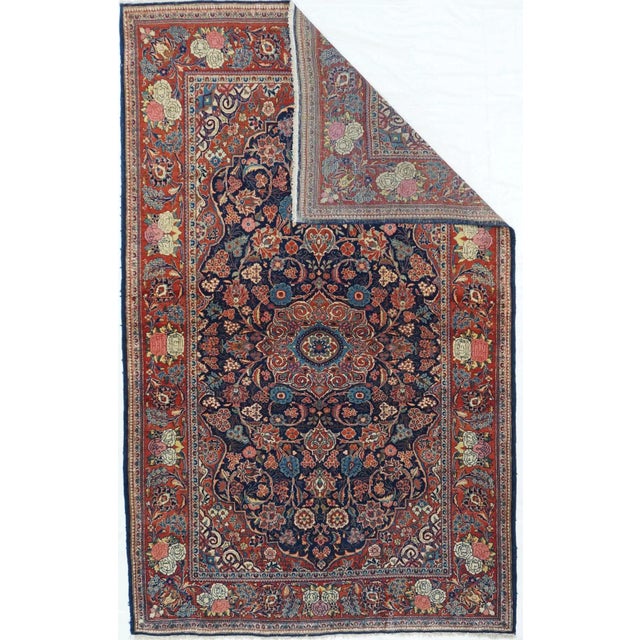 This urban central Persian curvilinear scatter reverses the usual Kashan color arrangement with a dark blue field,...