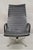 Vintage Herman Miller Charles and Ray Eames Design Swivel Aluminum Group Black Vinyl Arm Chair. Circa Late 20th Century....