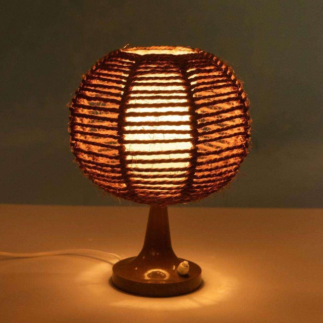 Unique 1970s table lamp with Japandi influences. This special lamp combines a warm, organic look with a minimalist design....