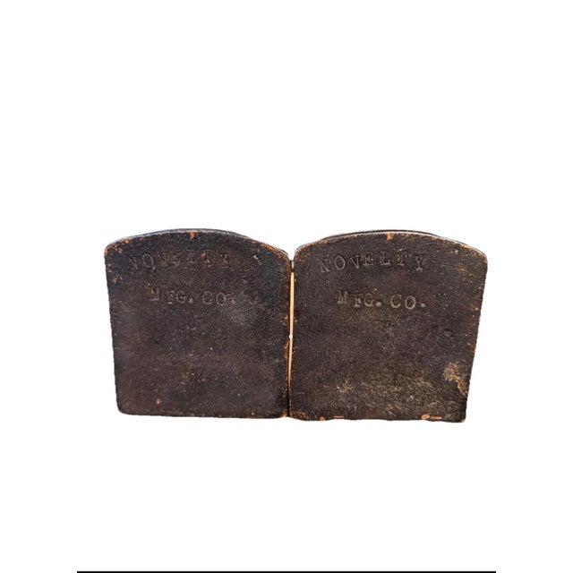 Striking pair of solid cast iron original Novelty MFG Co. bookends featuring the famous "End of the Trail" sculpture. Deep...
