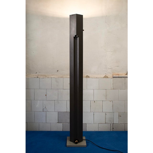 Floor lamp with metal structure, stone base, brass details. Dimmable Totem model Design Kazuhide Takahama Manufacturer...