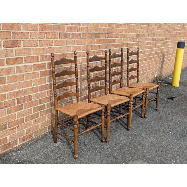 Bring timeless farmhouse or French Country charm to your dining room with this handsome set of four vintage ladder back...