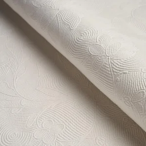 Schumacher Quilted Scroll Matelasse Fabric in Ivory