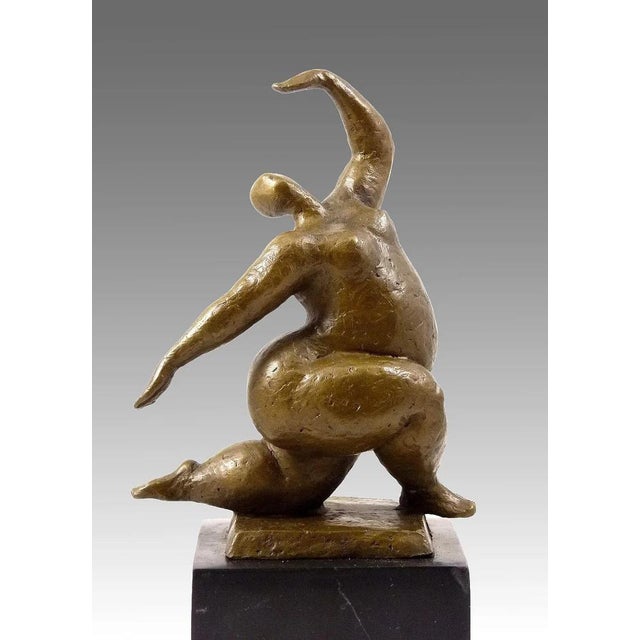 Enhance your interior with this bronze sculpture of a squatting nude dancer, symbolizing grace, strength, and harmony. The...