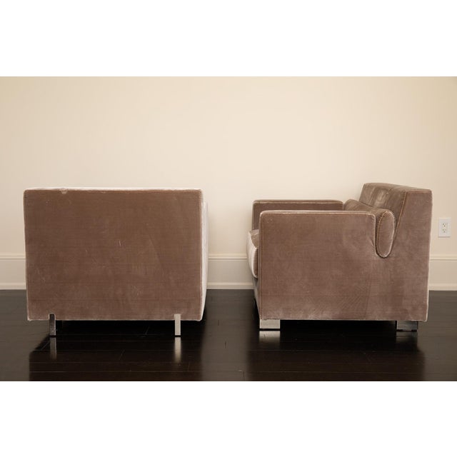 A sophisticated pair of silk-upholstered armchairs by India Mahdavi, designed exclusively for Ralph Pucci International....