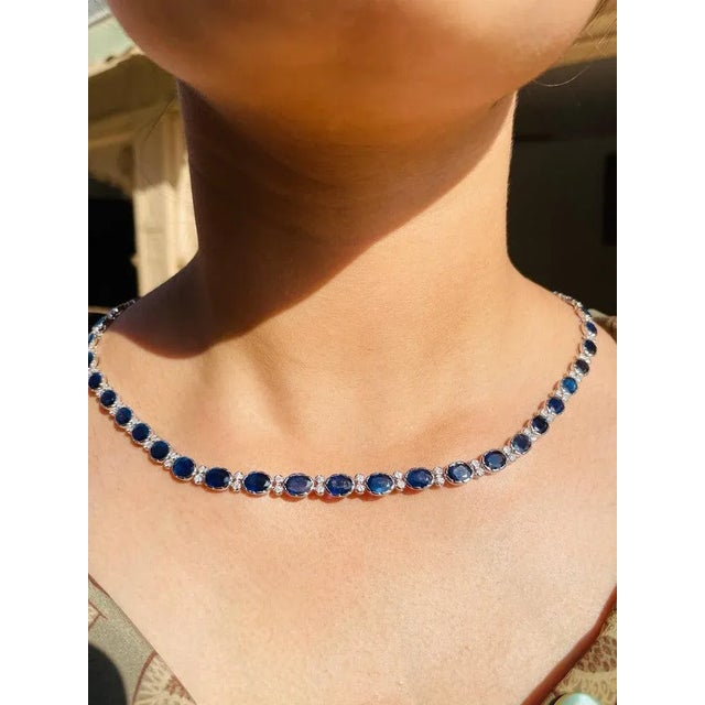 This is part of Chairish’s Fine Jewelry assortment. Blue Sapphire Necklace in 18K Gold studded with oval cut sapphire...