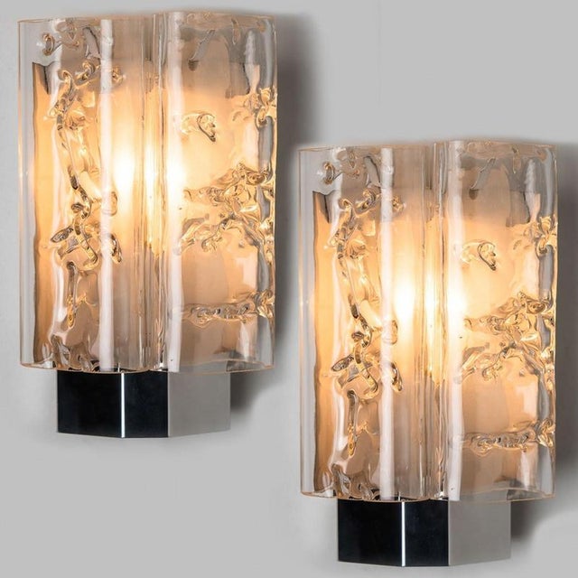 This set of structured ice glass wall sconces from the 1970s and were created by the iconic firm of doria leuchten in...
