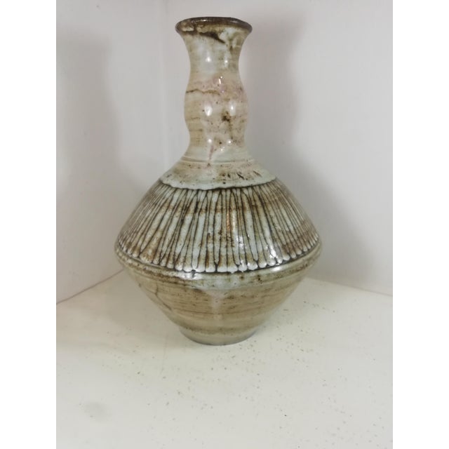Beautiful ceramic vase by Jacques Pouchain for Atelier Dieulefit, mid-twentieth century production. Decorated in an...