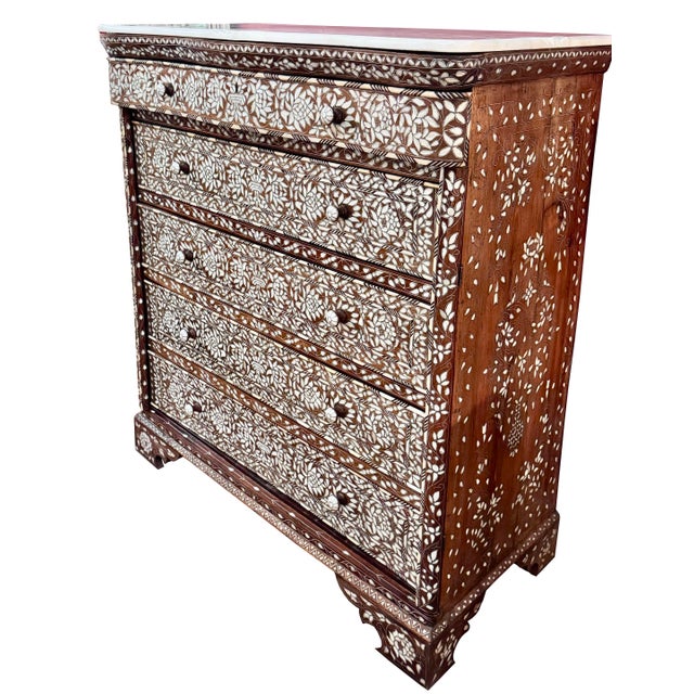 A magnificent late 19th-century Syrian highboy dresser with natural marble top, exquisitely handcrafted in Damascus and...