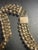 This Mid-Century Modern (MCM) statement necklace features an industrial, brutalist-inspired multi-strand design. Very...