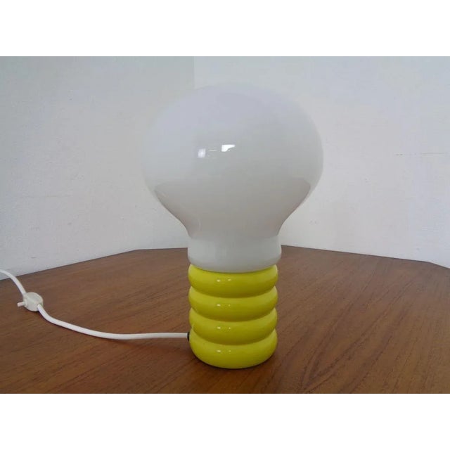 Yellow Ingo Maurer Bulb lamp from the 1960s. Cables and switches were replaced. I have official proof of authenticity such...